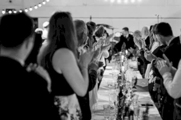 guests welcoming teh newlyweds at the reception