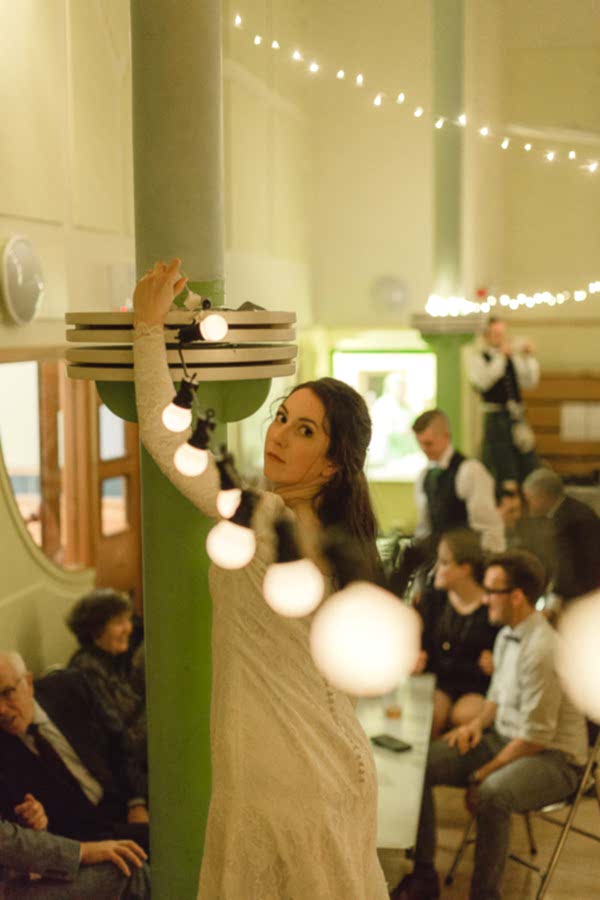 bride fixing lights at the venue