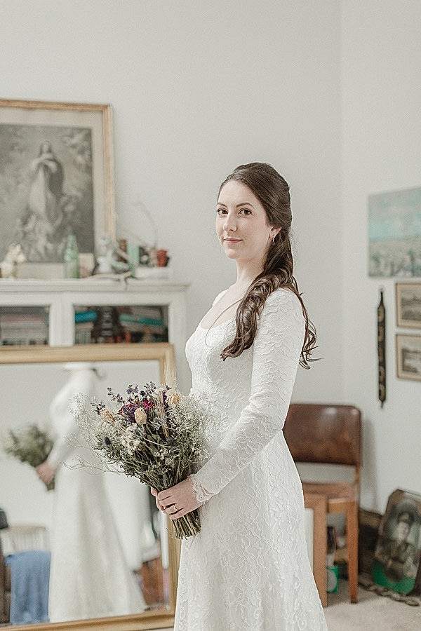 bride holding flowers and looking at the camera