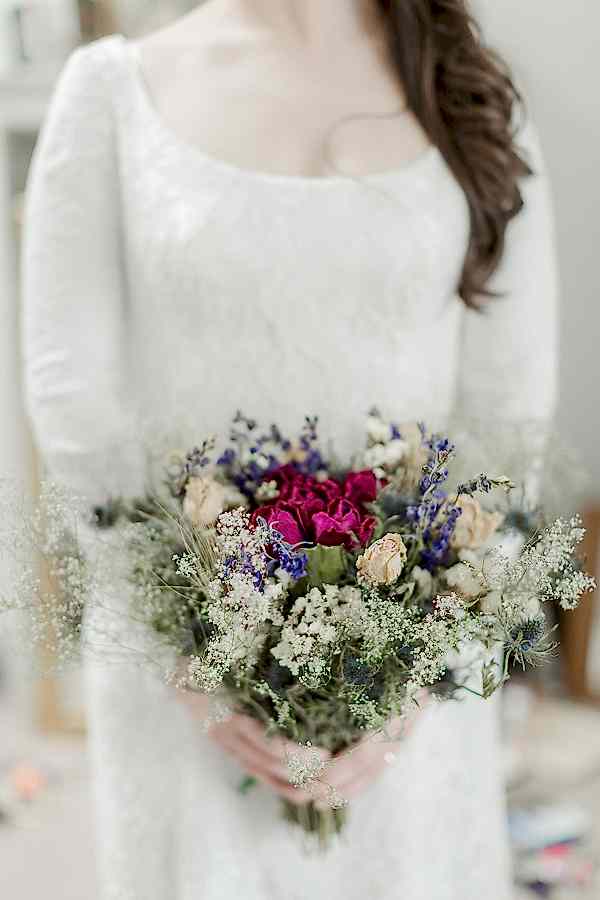 scottish bride holding dried flowers on isle of harris