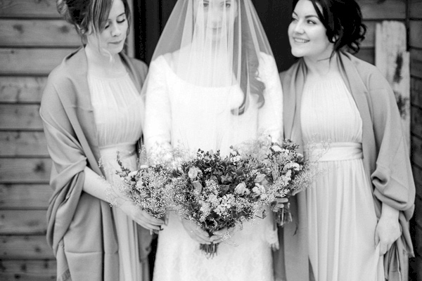 bride and bridesmates holding flowers