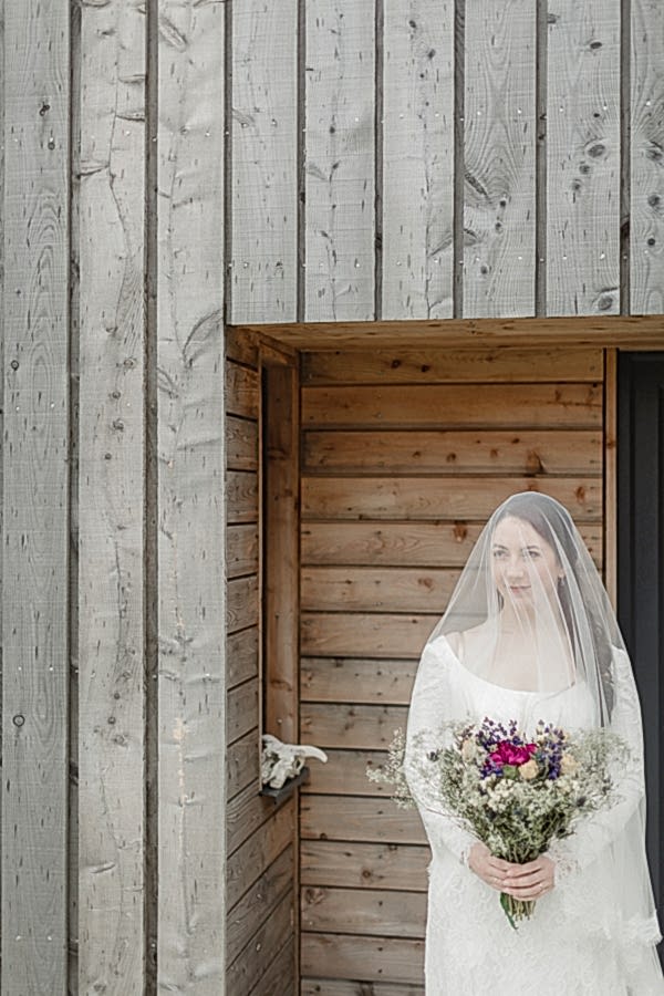 bride outside her home in harris