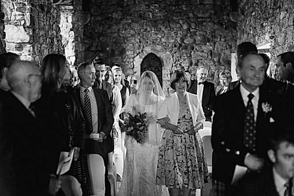 bride walkind down the aisle with her mother