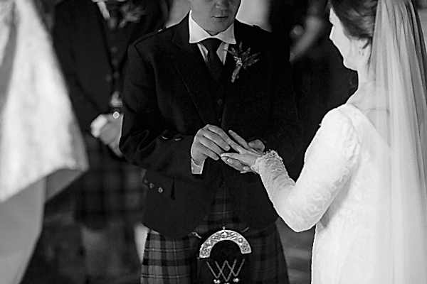 groom putting bride