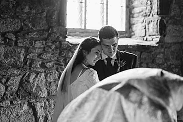 bride and groom embraced at ceremony