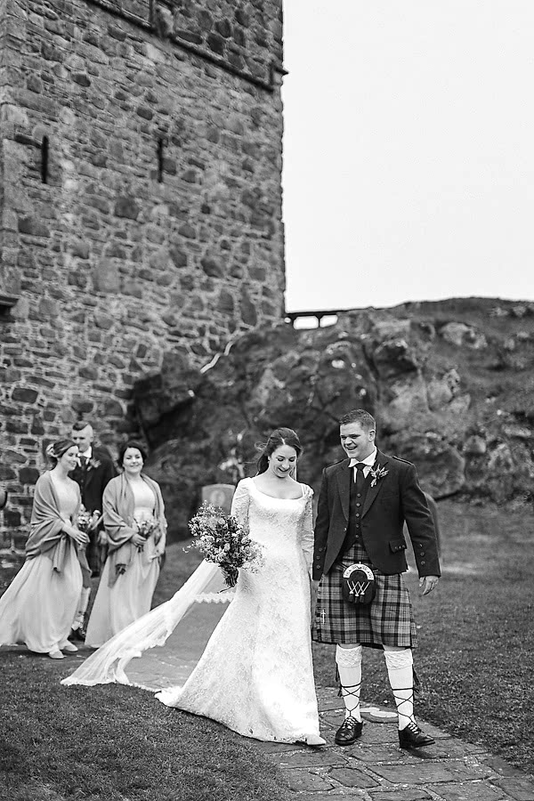 bridal party walking away after ceremony in scotland