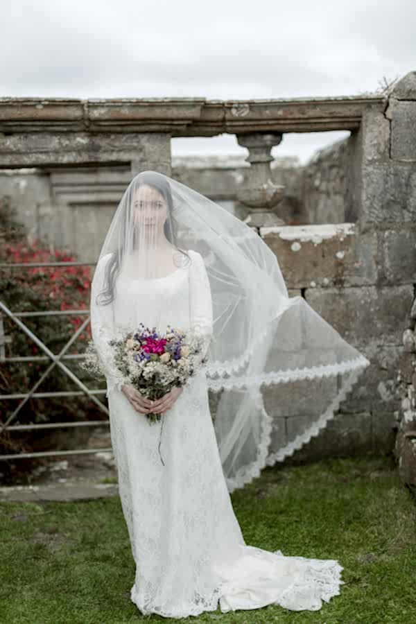 bride having her veil move by the wind scotland