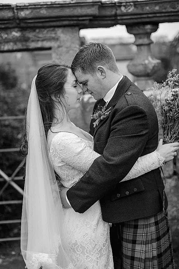 bride and groom embraced