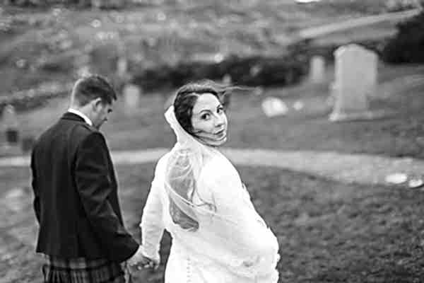bride lookig back at the camera while walking