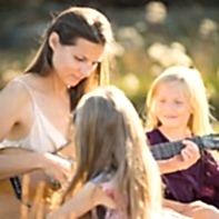mother and two girls playing gitar family photos