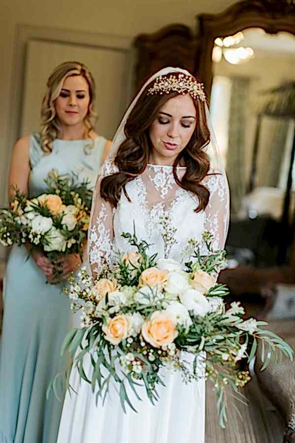 the bride looking at the flowers cromlix house 