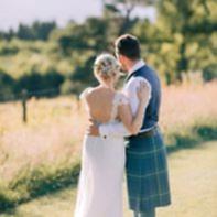 bride and groom empraced boturich castle wedding loch lomond scotland