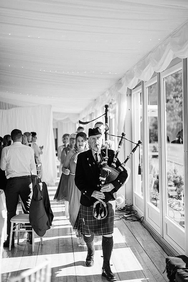 piper pipping guests for a dinner loch lomond 