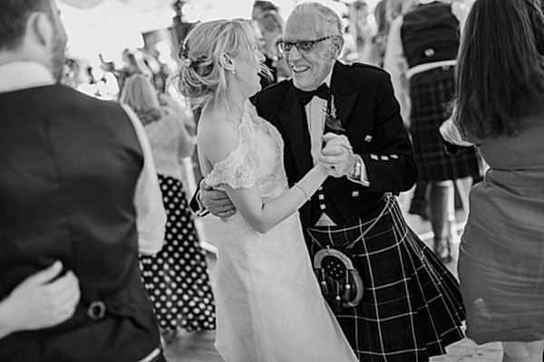 granddauther and grandfather at the wedding loch lomond 