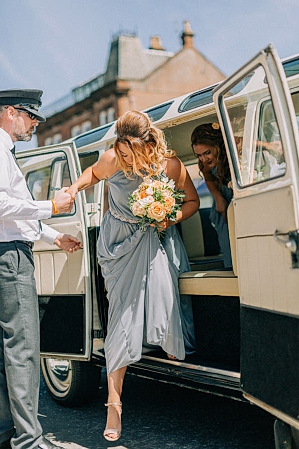bridesmaids getting our of the car 
