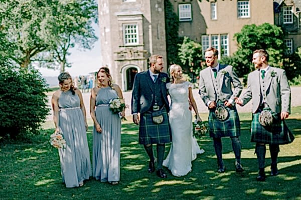 bridal party walking outside of boturich castle loch lomond