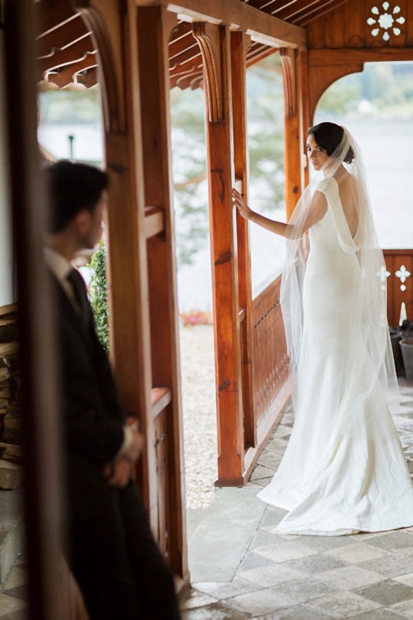 bride looking at groom the lodge on loch goil scotland