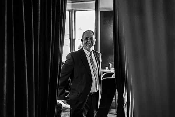 father of the bride seeing her daughter in the wedding dress for the first time
