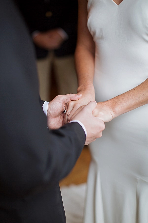 bride and groom holding hands