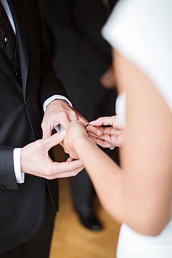 bride is putting groom