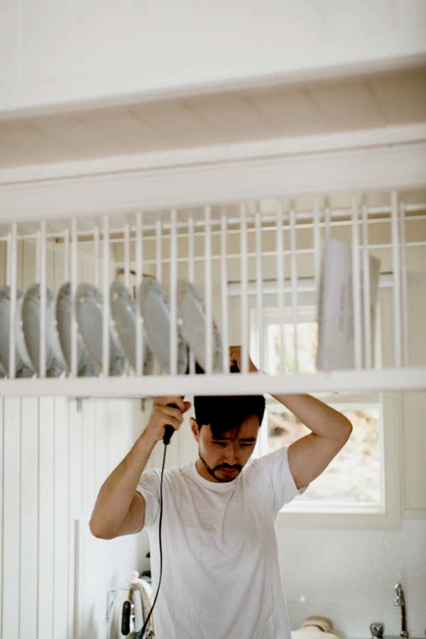 groom drying his hair during preparations