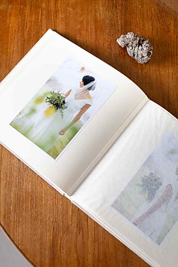 wedding album open with a picture of a bride at the lodge on loch goil