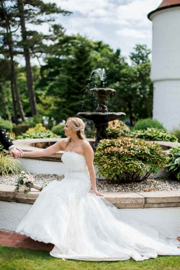 fountain at lochgreen hotel bride sitting