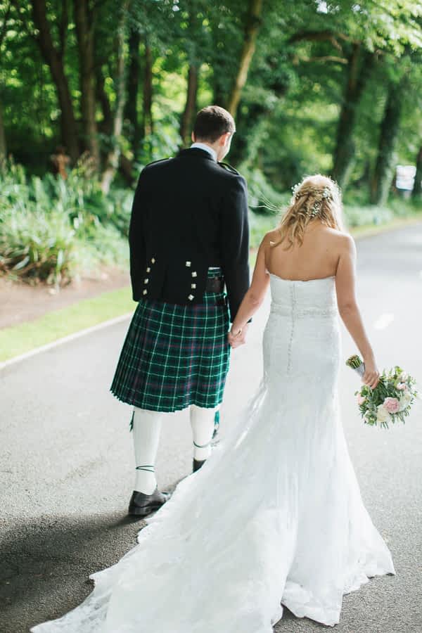 bride and groom walking away