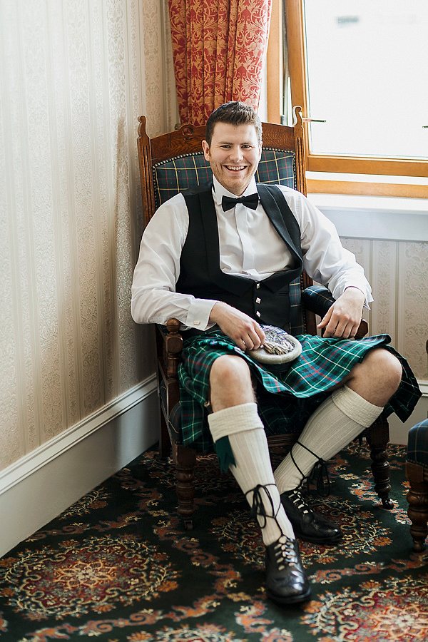 groom sitting before ceremony