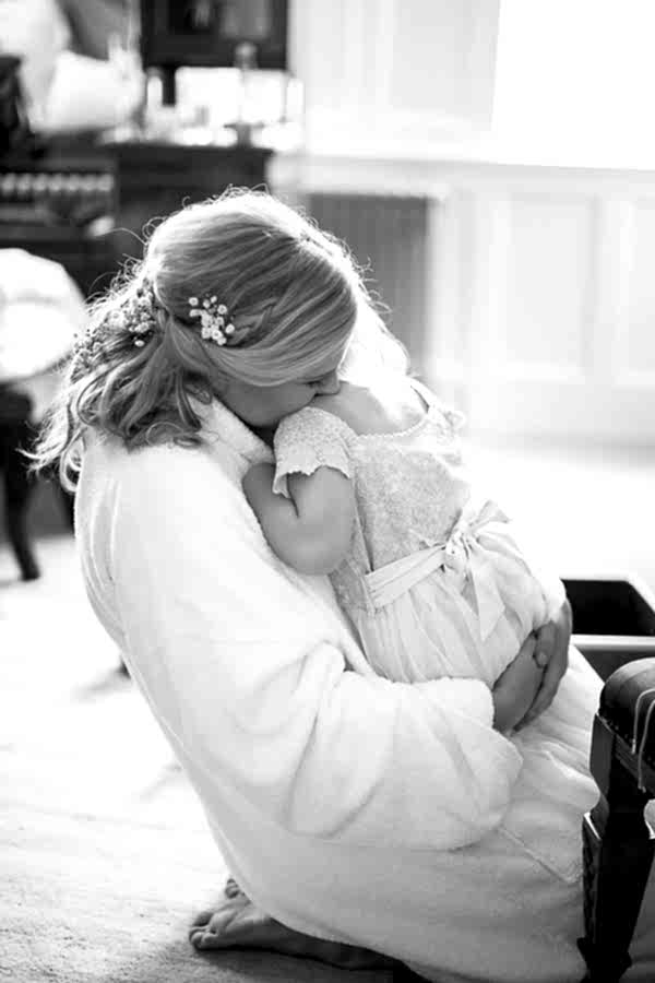 bride huging flower girl