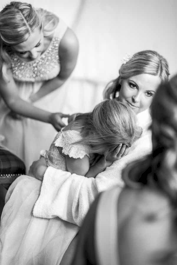 flower girl embraced