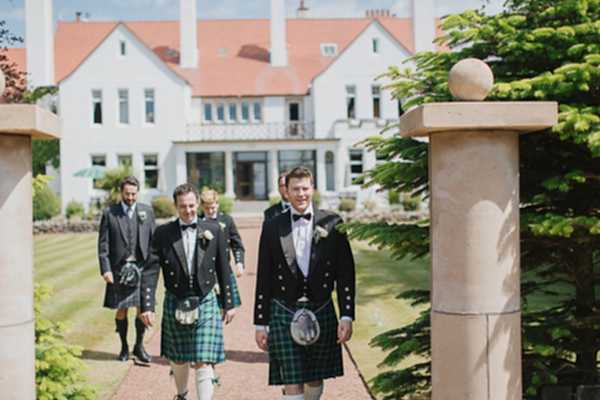 lochgreen wedding photographer groomsmen walking in the garden