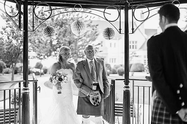 bride escorted by his dad for ceremony