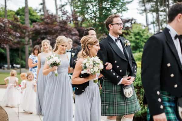 bridal party leaving teh ceremony