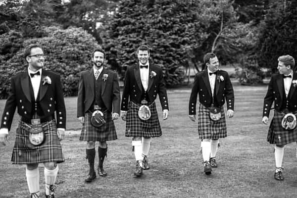 groom and groomsmen walking 