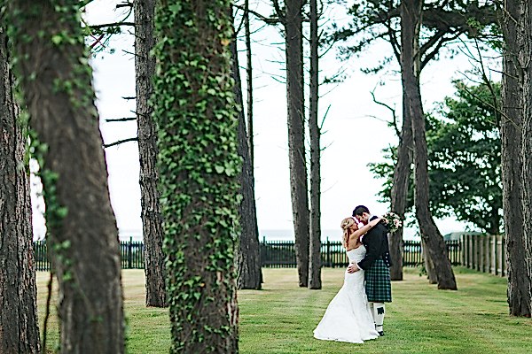 newlyweds embraced in the garden
