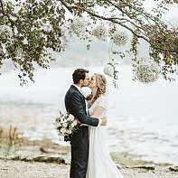 bride and groom kissing wedding at the lodge on loch goil by fotogenic of scotland