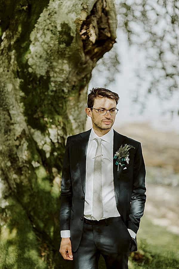 a portrait of the groom at the lodge on loch goil