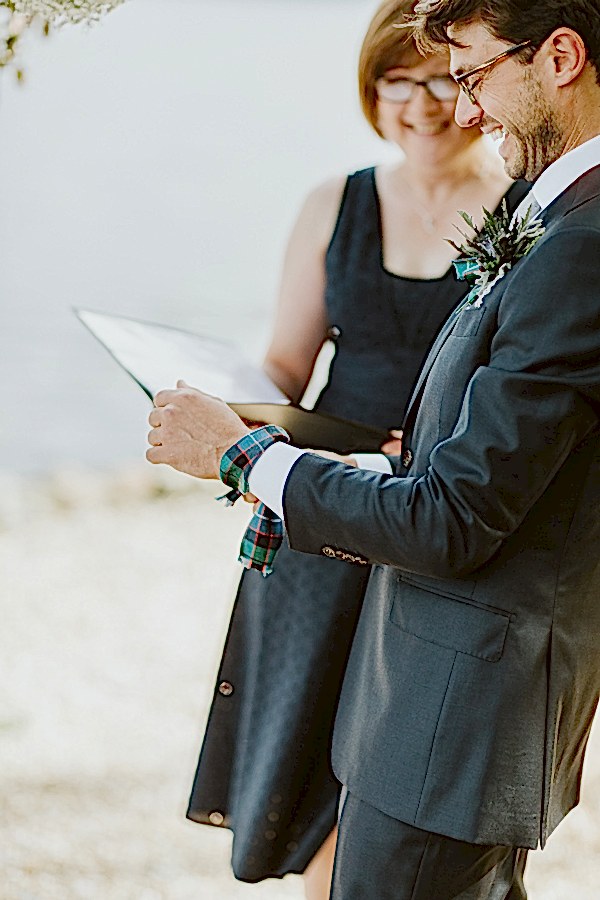 groom laughing during ceremony
