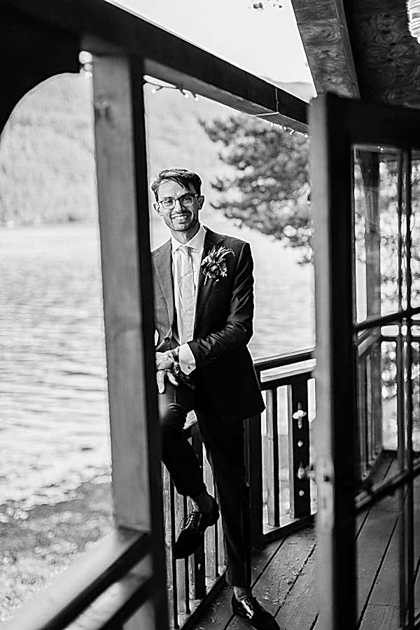 groom looking at the bride at tree house