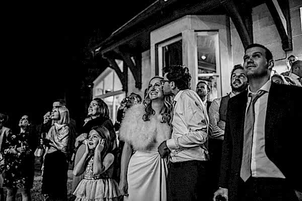 bride and groom kissing during fireworks at the lodge on loch goil in scotland