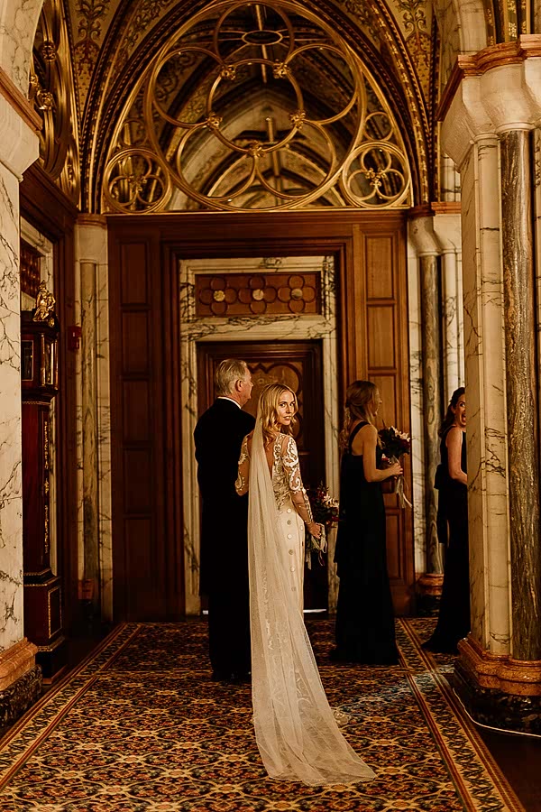 bride looking back just before going down teh aisle