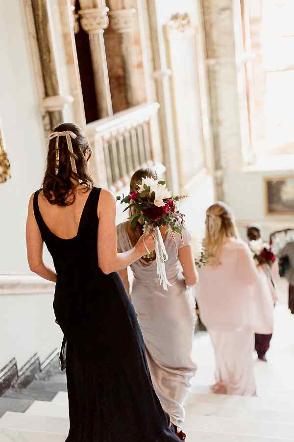bridesmates walking down teh stairs