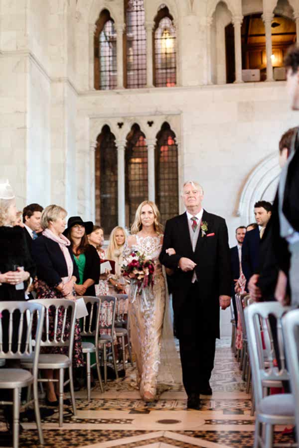 bride walking down teh aisle mount stuart in scotland