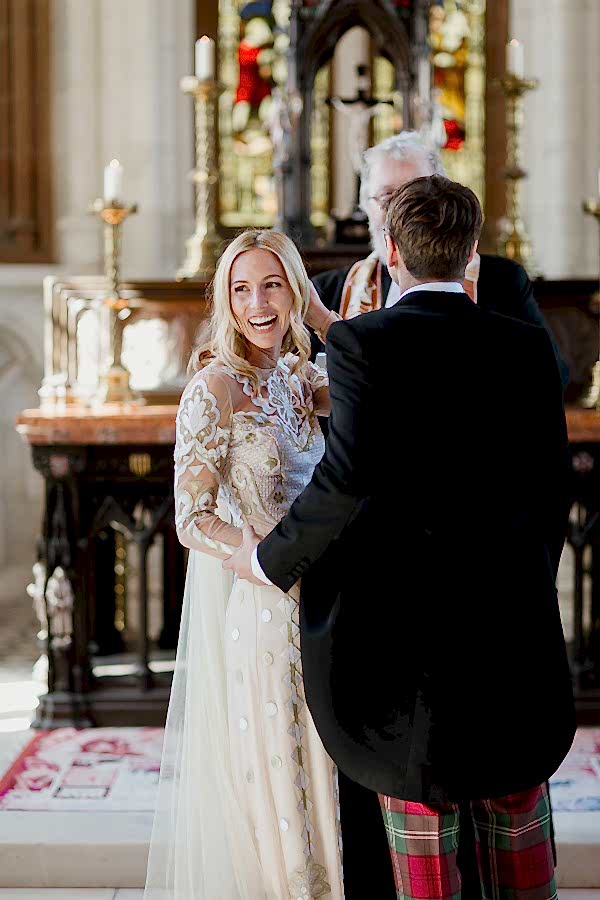 scottish bride laughing after first kiss