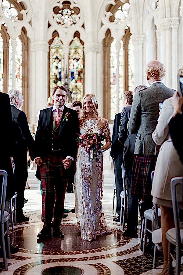 newlyweds walking down the aisle at mount stuart