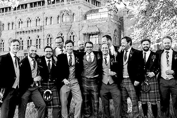 groom with friends at wedding venue