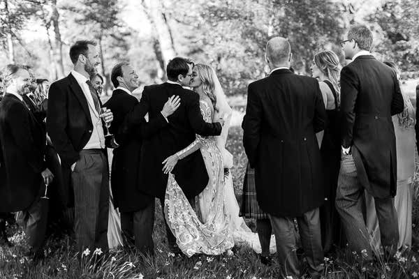 bride and groom kissing in the garden at mount stuart 