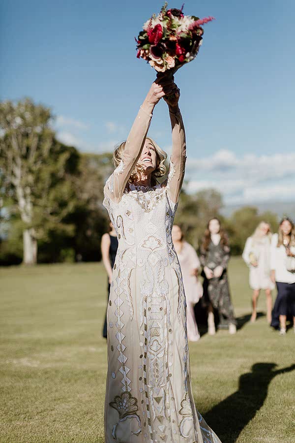 bride tossing bouquet at mount stuart