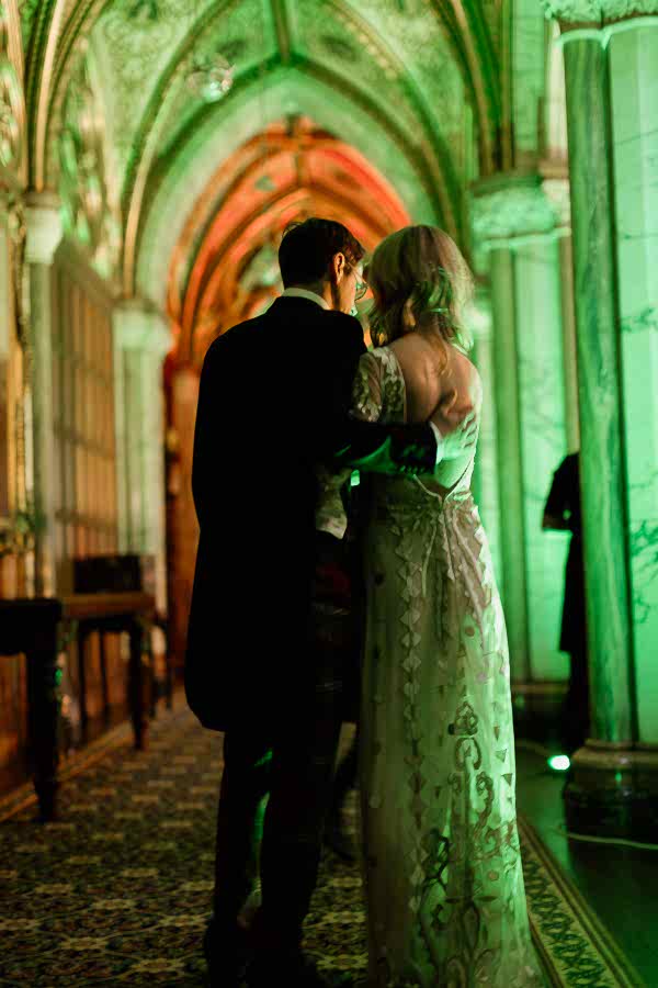 newlyweds embraced at wedding